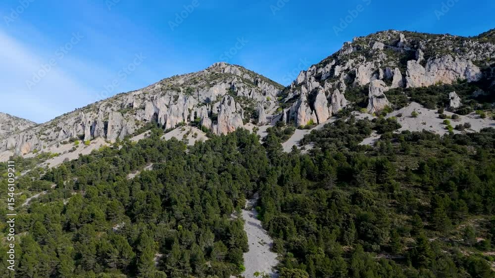 Drone smooth orbit flight with views of trees, forest and intriguing Rock formations.
Location: Les Agulles De La Serella, in Quatretondeta, Alicante, Spain. Drone smooth orbit flight with views of trees, forest and intriguing Rock formations.
Location: Les Agulles De La Serella, in Quatretondeta, Alicante, Spain.