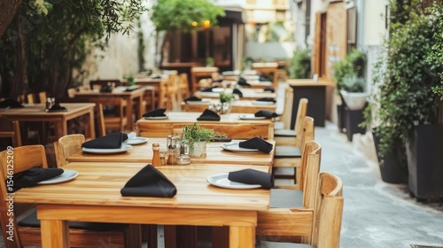 Common settings of cafe interior with wooden tables and plate sets