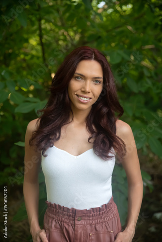 A pretty brunette woman portrait in nature