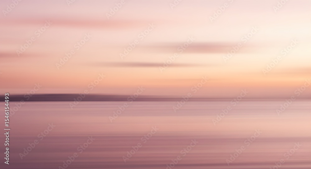 Fototapeta premium Abstract blurred landscape with soft pink and orange hues and a dark horizontal line at the horizon