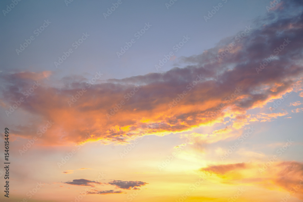 Dark and light clouds blend together in a stunning sunset sky. The sun's golden glow subtly illuminates the edges of the clouds, creating a dreamy and moody effect. Dark and light clouds blend together in a stunning sunset sky. The sun's golden glow subtly illuminates the edges of the clouds, creating a dreamy and moody effect.