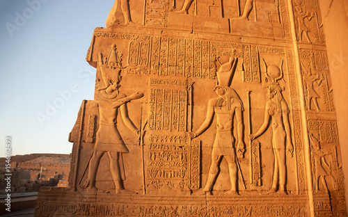Ancient egyptian carvings on the walls of Kom Ombo temple in Aswan, Egypt
