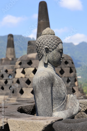 Buddha statue in a opened Stupa of Borobudur Temple. Indonesia