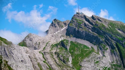 Stunning mountain landscape with rocky peaks under a bright blue sky