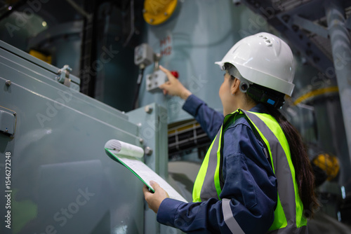 Tableau sur toile Gas insulated switchgear substation engineer inspects equipment with clipboard i