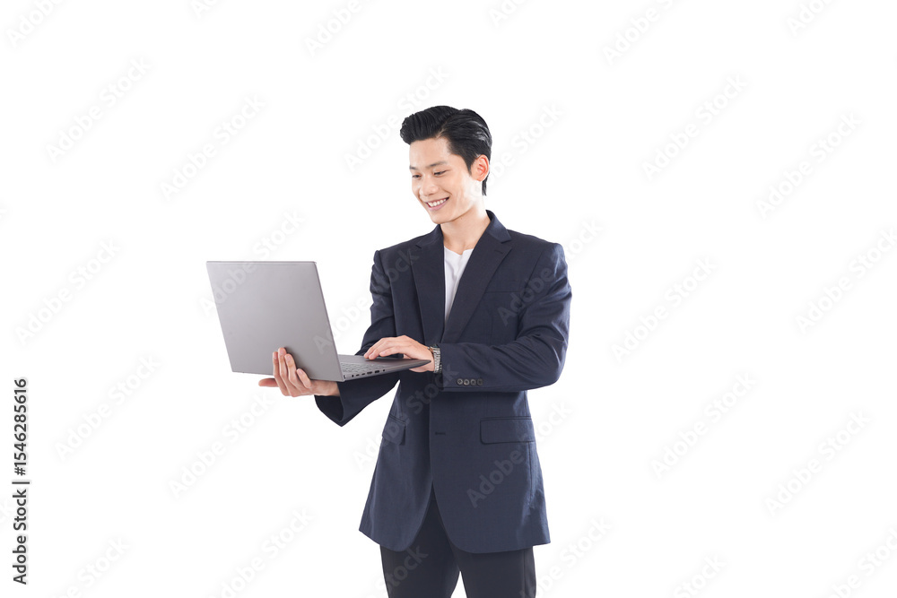 Full-body shot of Asian businessman working on laptop, confident expression Full-body shot of Asian businessman working on laptop, confident expression