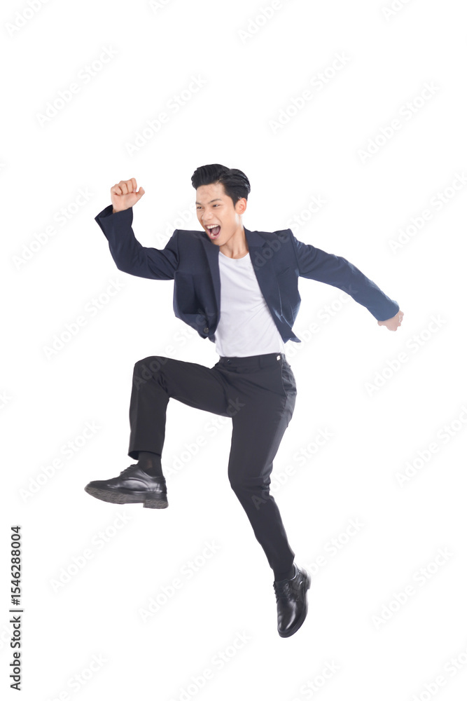 Asian businessman jumping with joy, cheerful expression in motion Asian businessman jumping with joy, cheerful expression in motion