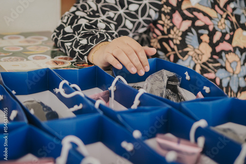 Canvas Print close up of hand on goodie bag