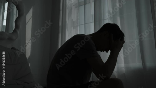 Alone in silence, a man confronts inner demons, facing mental health issues and suicidal thoughts