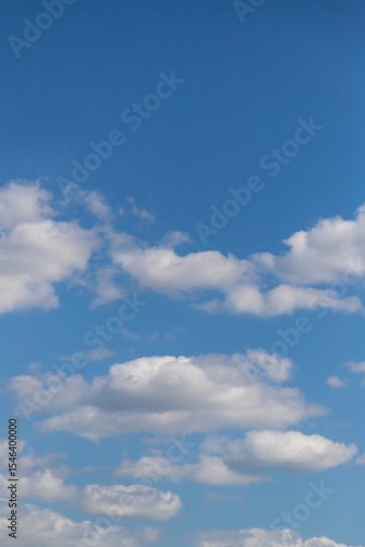 Beautiful blue sky with white Altocumulus undulatus clouds.