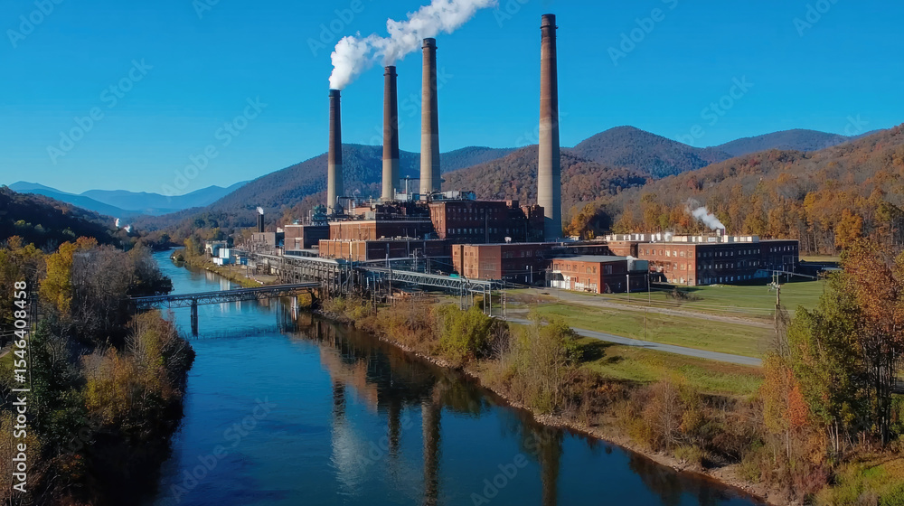 Obraz premium Industrial building factory river autumn mountain smoke blue sky reflection landscape outdoor