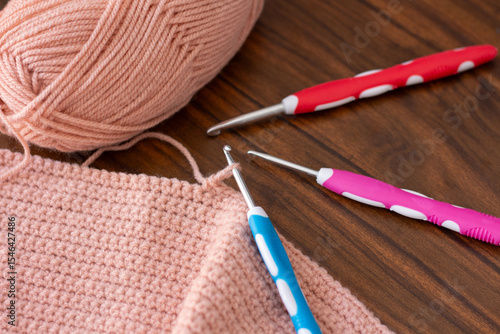 Hooks and threads for crocheting. Hobbies, creativity and handicrafts. Home leisure. Photo view from above