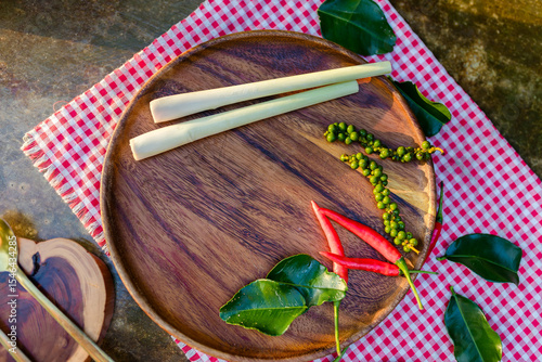 hai-cooking-herbs-wooden-plate-flatlay