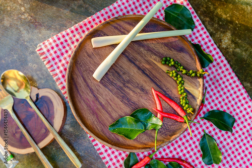 hai-cooking-herbs-wooden-plate-flatlay