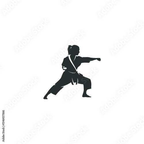 Female karate fighter silhouette in uniform performing punching technique professionally