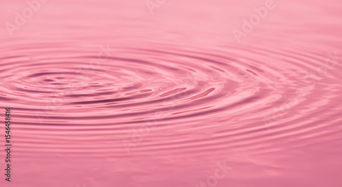 Pink Water Surface with Ripples: A Close-Up Study of Texture and Abstraction