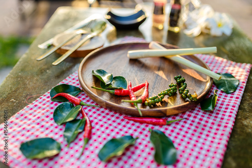 hai-cooking-herbs-wooden-plate-flatlay