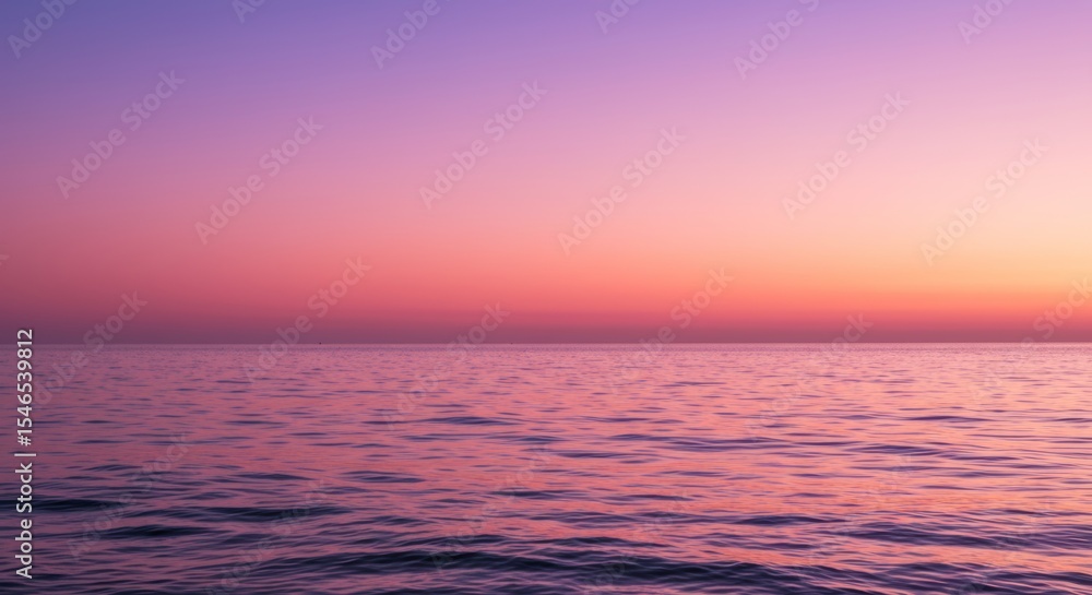 Obraz premium Calming ocean scenery at sunset with pink and purple sky background