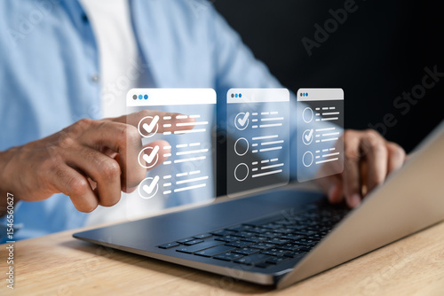 Fotografie Digital checklist and approved document interface on laptop task management and confirmation process