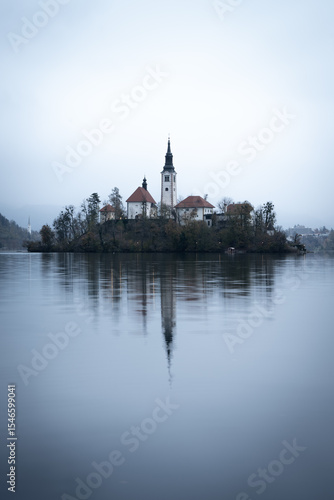 Wallpaper Mural Vertical shot of island in the middle of lake with church on it during foggy day, Slovenia, Europe Torontodigital.ca