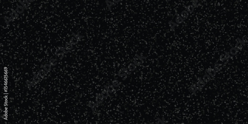 Dark speckled texture depicting crushed rock or ground surface showing a muted and gradual tonal transition