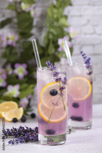 Summer refreshing non-alcoholic lavender spritz drink with blueberries