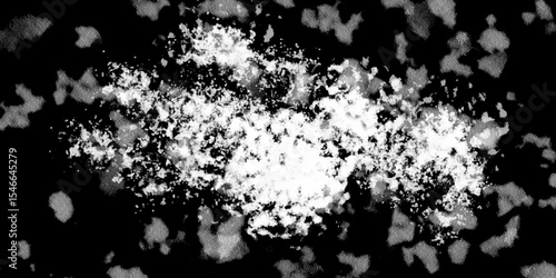 Snowflakes on dark background. white icy snowflakes isolated on black background, natural background. white crystalline powder on a black background. sugar dust. texture, pattern and clipping.