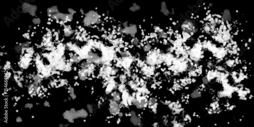 Snowflakes on dark background. white icy snowflakes isolated on black background, natural background. white crystalline powder on a black background. sugar dust. texture, pattern and clipping.