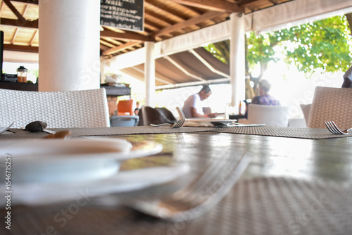 Dining Table with Cutlery at a Hotel on Unawatuna Beach, Galle, Sri Lanka.