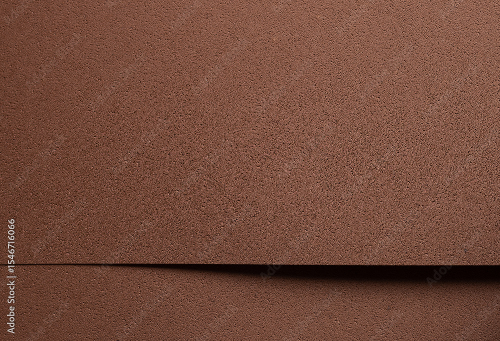 Fototapeta premium Premium designer paper in chocolate brown tones with pitted porous texture and spongy perforated