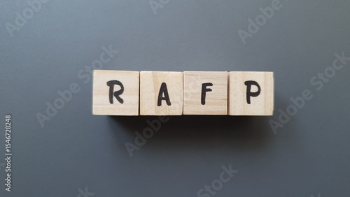 Photos RAFP acronym made of wooden letter cubes on dark background