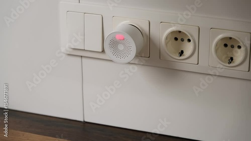 Modern Gas Detector Alerting with Red Light Indicator in Contemporary Home Electrical Setup