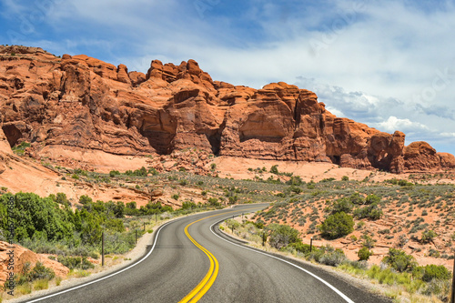 Winding road through spectacular landscape scenery in the Arches National Park in Moab. No people.