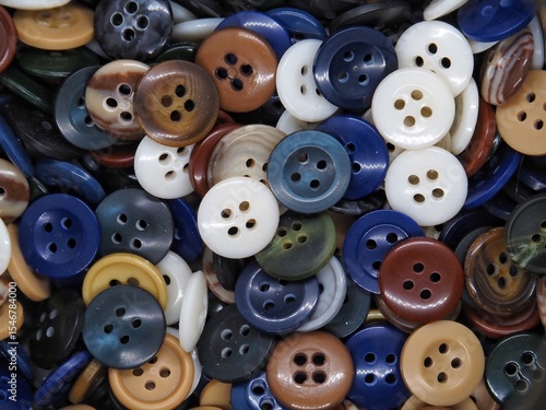 Colorful Sewing Buttons on White Background