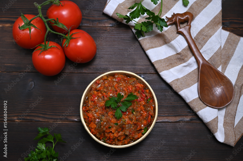 bowl with eggplant and vegetable appetizer on wooden table bowl with eggplant and vegetable appetizer on wooden table