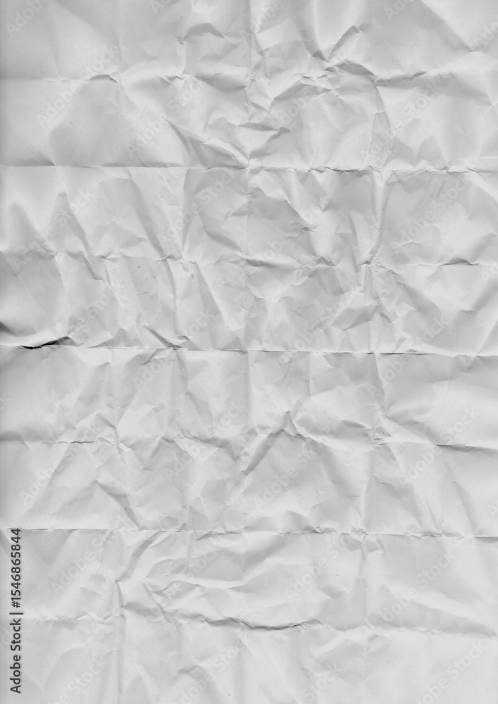 Obraz premium Crumpled and flattened white paper sheet with textured surface. Natural wrinkles and creases form an abstract background. Perfect for grunge effects, recycled material themes