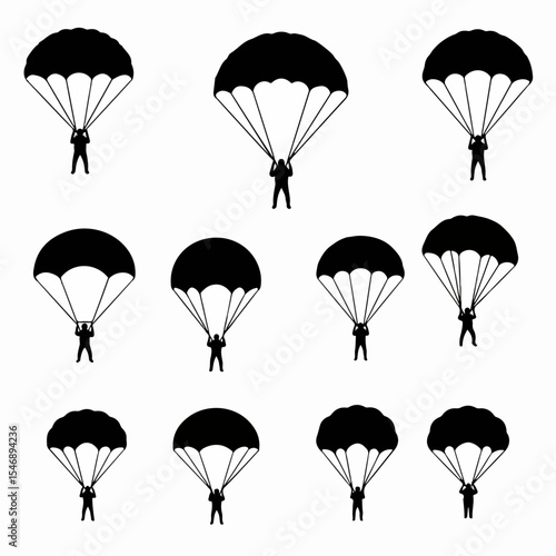Silhouettes of parachutists on white background