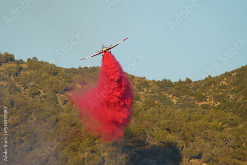 Single Engine Air Tankers Drop Fire Retardant at a Wildfire