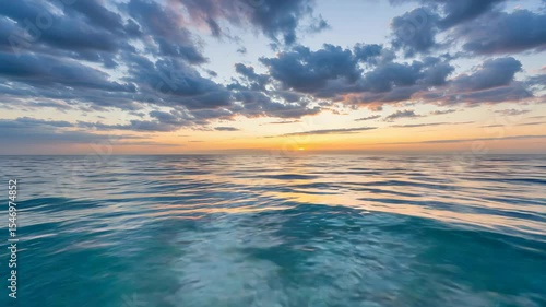 Turquoise Ocean Reflecting Sunset with Cloudscape at Dusk