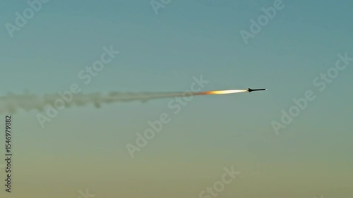 Modern city in distance with air defense dome intercepting missile