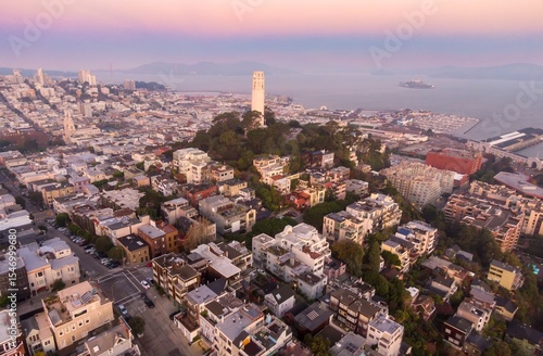 Aerial view of Coit Tower, a landmark in San Francisco, California, USA. The tower stands atop Telegraph Hill, overlooking the city, bay, and Alcatraz Island.