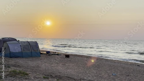 Camping by the sea sunset, sunrise, tent