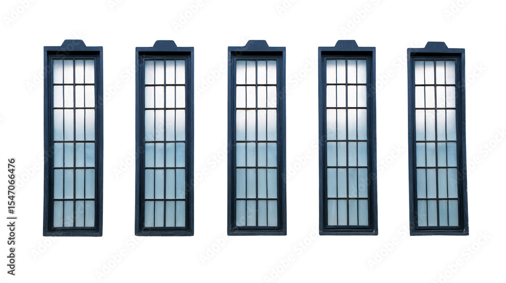 Obraz premium Five tall, rectangular windows with grid pattern and dark frames are aligned row, creating symmetrical and modern architectural design. windows reflect soft, diffused light, adding serene