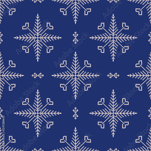 Cross-stitch seamless pattern with snowflakes on a blue background. Ukrainian traditional embroidery. Boho style. Pixel art, vyshyvanka, textiles, rugs, curtains, and wallpaper.
