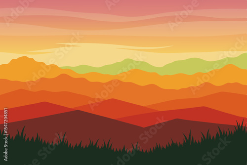 Golden light bathes the mountain landscape, revealing a serene interplay of sunrise and sunset hues across the misty peaks and forested hills