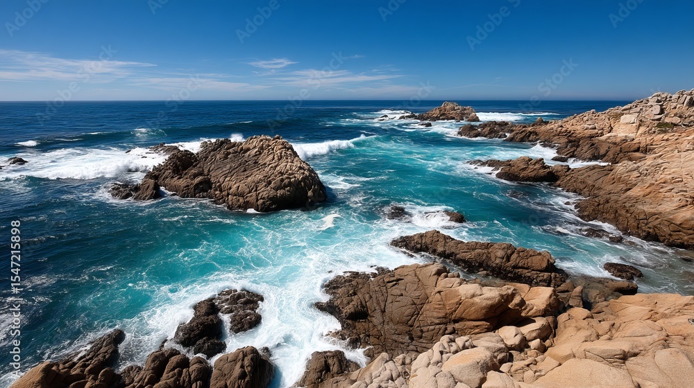 Rugged rocky coastline with crashing waves under a clear blue sky Rugged rocky coastline with crashing waves under a clear blue sky