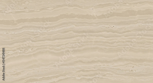 A close up shot showing a beige colored stone surface with horizontal wavy lines and a grainy texture