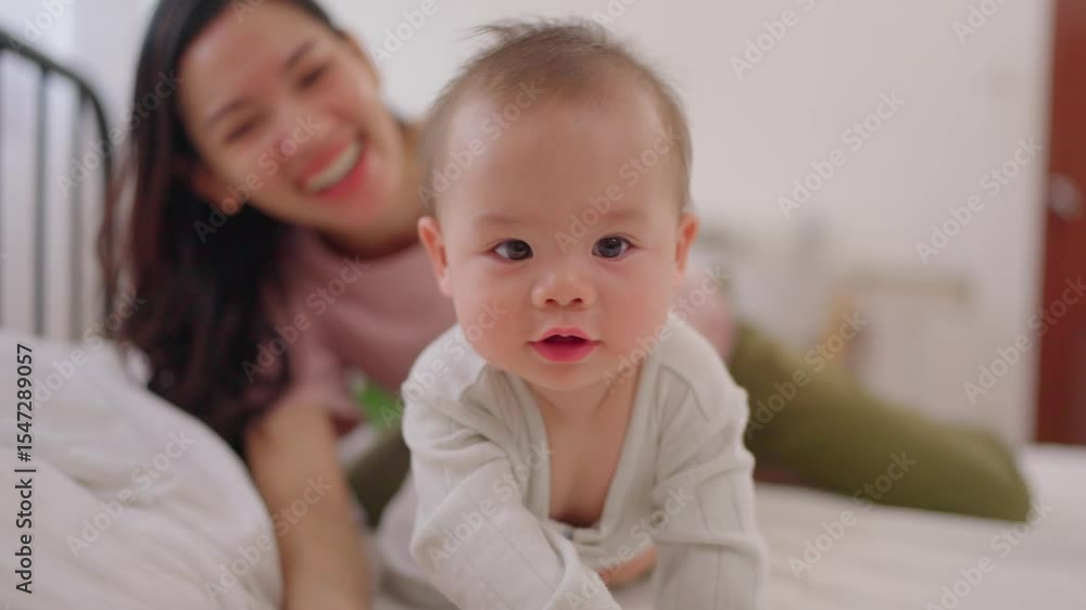 Asian single mother lovingly cares for and raises her baby boy at home. Asian single mother lovingly cares for and raises her baby boy at home.