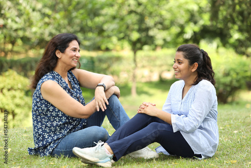 Tapeta Indian happy mother having fun caring, hugging, enjoyment and  bonding loving wi