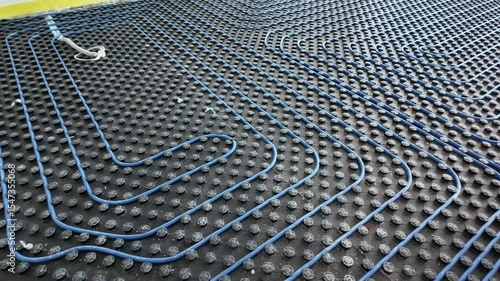 Modern Underfloor Heating System Installation. Energy-Efficient Radiant Floor Comfort and Renovation. Modern heating system in a new home